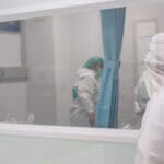 Medical professionals wear PPC in negative pressure room