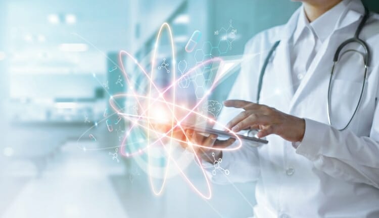 a doctor holds an iPad, overlaid with graphics of engineering