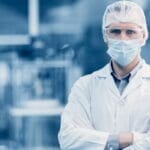 scientist standing in a cleanroom