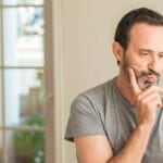 man looking confused at his phone