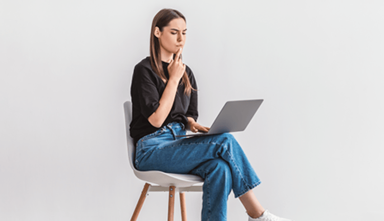 woman looking at her computer