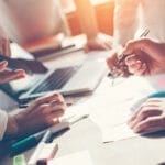 people working around a table