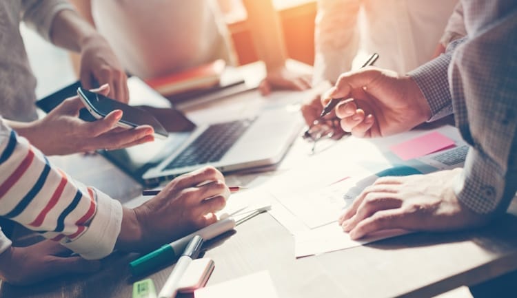 people working around a table