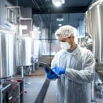 scientist at pharmaceutical manufacturing facility