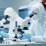 two scientists working in a cleanroom