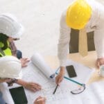 AEC team reviewing blueprints