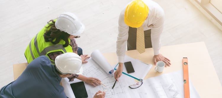 AEC team reviewing blueprints